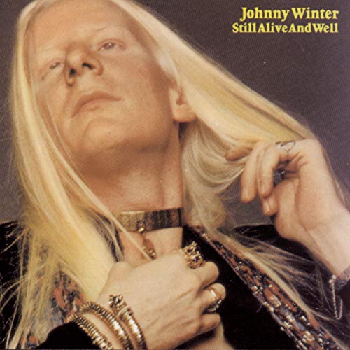 Album cover featuring Johnny Winter with long blonde hair and ornate jewelry.