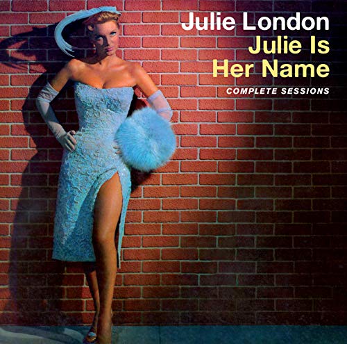 "Album cover featuring Julie London in a blue dress against a brick wall."