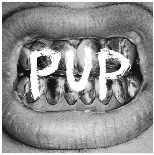 A black and white close-up of a mouth with "PUP" written between the teeth.