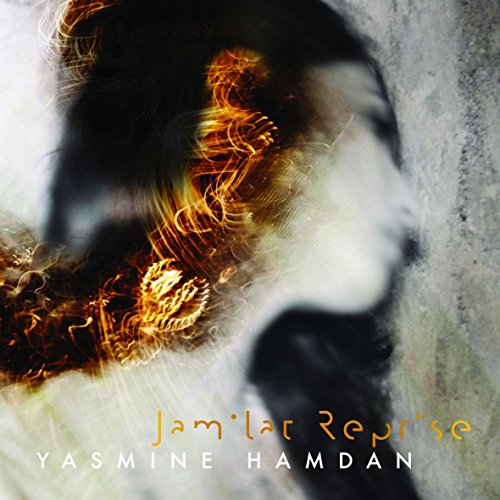Album cover with a blurred woman's face and orange, white text on gray background.
