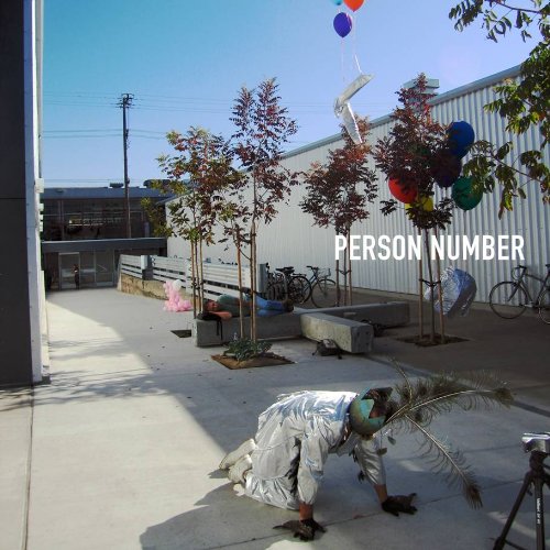 "CD case cover with person kneeling, trees, and balloons, 'PERSON NUMBER' text."