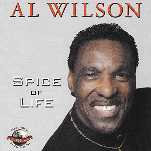 Album cover with a man smiling, wearing a black shirt and gold chain.