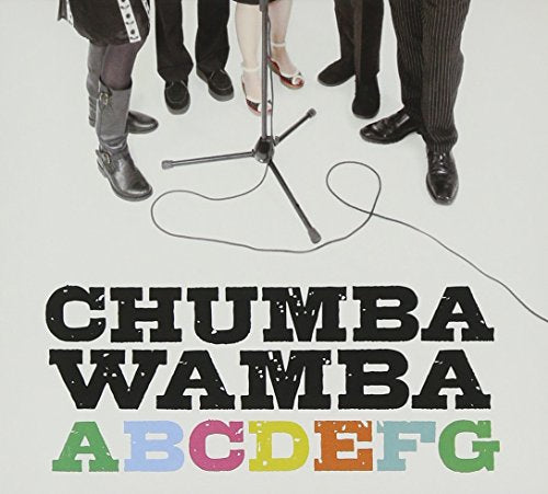 "Album cover with band members' legs around a microphone stand and colorful title text."
