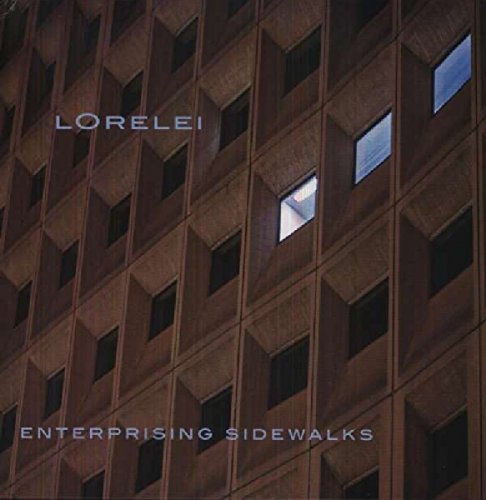 Album cover featuring a tall, brown building with numerous windows, text at top and bottom.