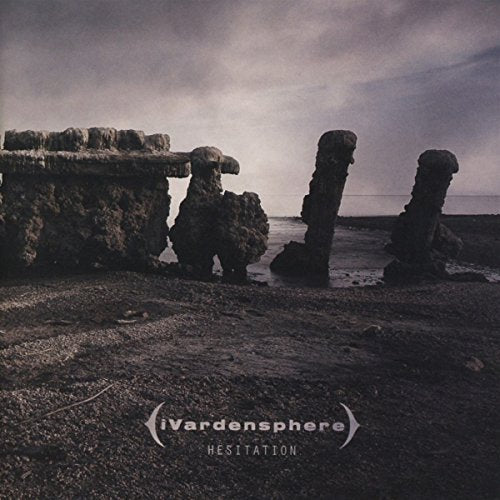 "Album cover with rocky pillars by the sea, dark and cloudy sky."