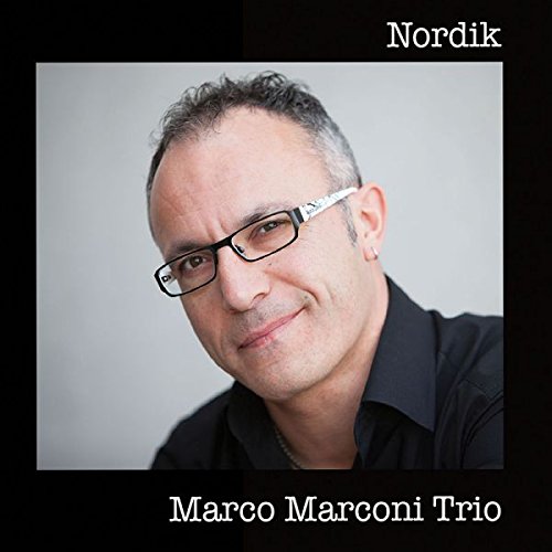 "CD cover with a man wearing glasses against a gray background."