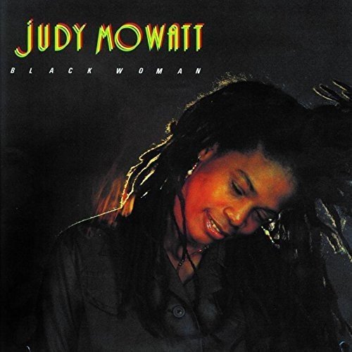 Album cover featuring a woman with dreadlocks, gazing down, against a dark background.