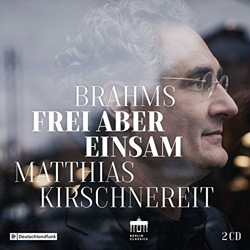 "CD cover with a man's profile and white text on a blurred background."