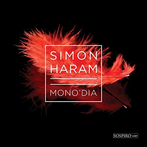 "Album cover with red feathers and white text on a black background."