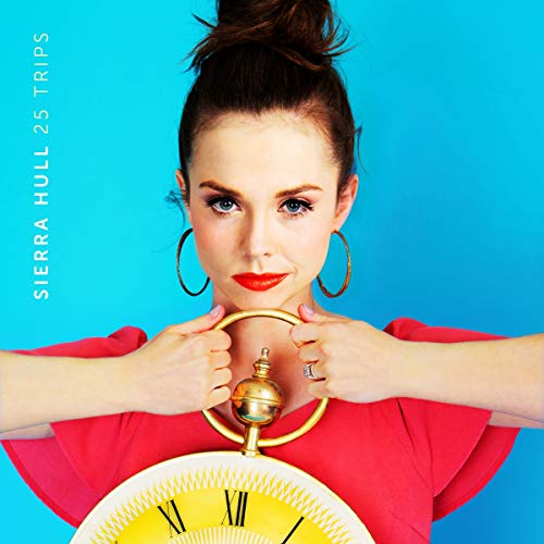 Woman in red shirt holding clock against her chin, blue background, album cover artwork.