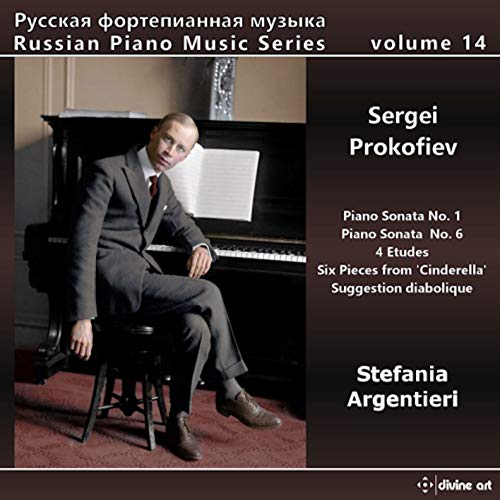 CD cover with a man sitting at a piano, wearing a gray suit.
