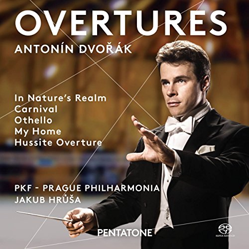 Conductor in tuxedo holding baton, with white text on dark background.