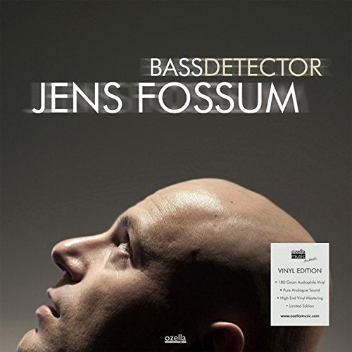 "Vinyl record cover with a man's head tilted back, dark background, and white text."