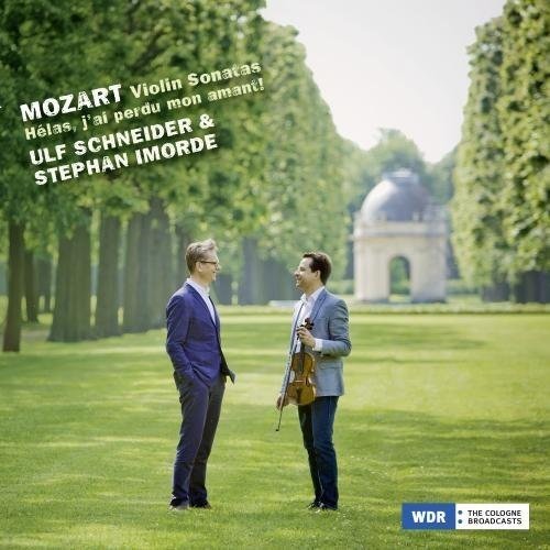 "CD cover showing two men in suits standing in a park."