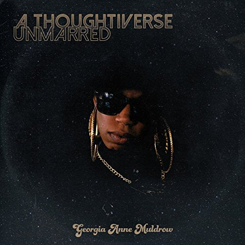 "Album cover with a person wearing sunglasses and gold jewelry against a dark, starry background."