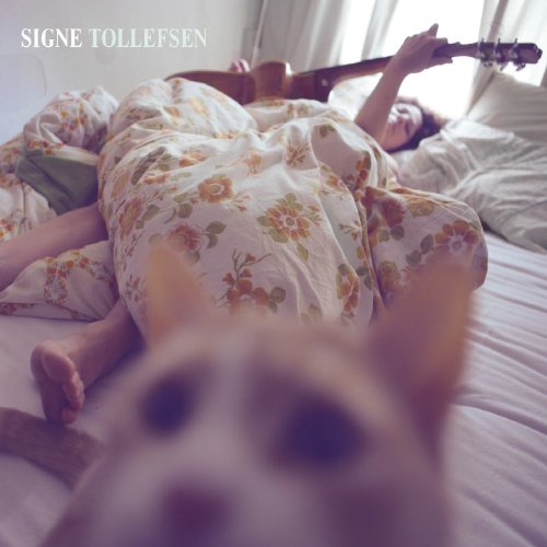 Album cover of Signe Tollefsen featuring a woman lying on a bed with a guitar.