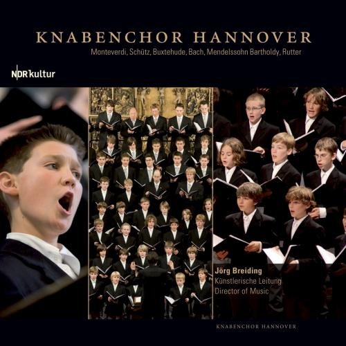 "CD cover featuring a choir of boys in formal attire singing with sheet music."