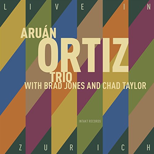Aruán Ortiz Trio CD cover with multicolored diagonal stripes and artist's name prominently displayed.