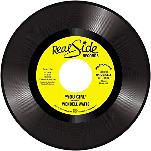 Black vinyl record with a yellow label on a white background.