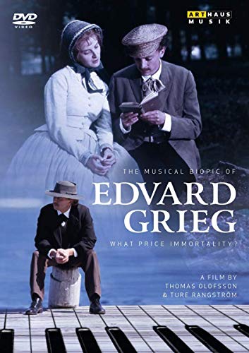 DVD cover featuring a man sitting on piano keys with two people above.