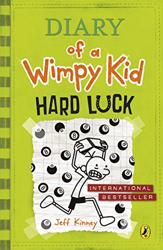 The image is a green book cover with a cartoon character. Alt text: Green book cover with cartoon boy surrounded by bad luck symbols.