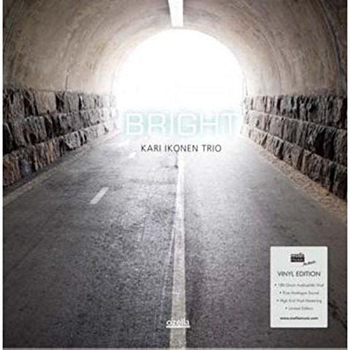 "Album cover featuring a tunnel with light at the end, titled 'Bright' by Kari Ikonen Trio."