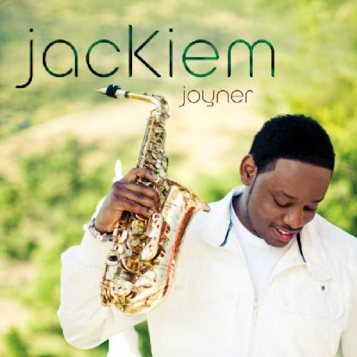 Album cover featuring a man holding a saxophone, smiling, against a green background.