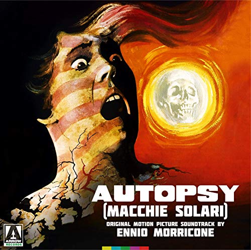 "Album cover featuring a mummified man screaming at a glowing skull on an orange background."