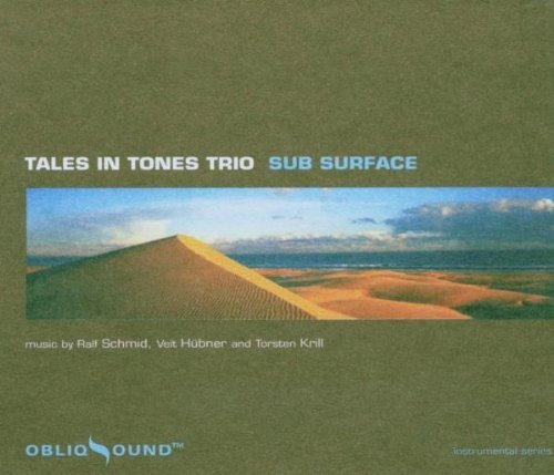 "CD cover with desert landscape and 'Tales in Tones Trio Sub Surface' text."