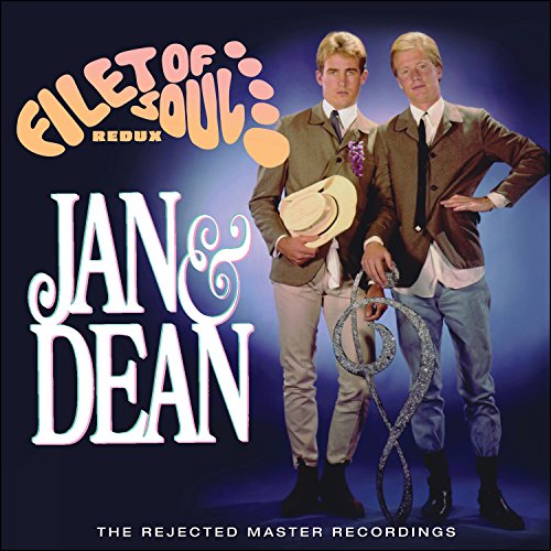 "Album cover with two men in suits, one holding a hat and lasso."