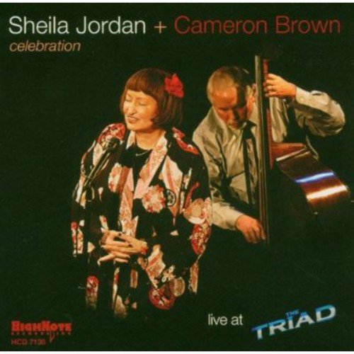 "CD cover featuring a woman singing and a man playing double bass together."