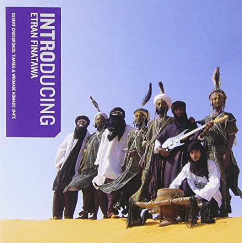 "CD cover featuring men in traditional robes and headdresses on a sandy surface."