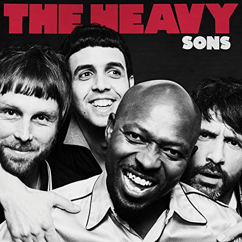 The image shows a black-and-white photo of four men with red and white text.