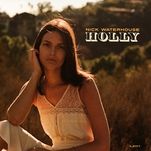 Album cover featuring a woman in a white top sitting outdoors with text overlay.
