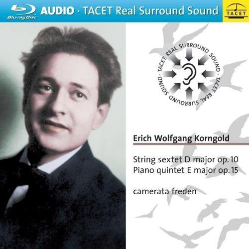 "Erich Korngold's portrait alongside text and seagull silhouettes on a white background."