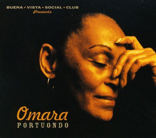 Album cover with a woman's face and hand on her forehead, against a black background.