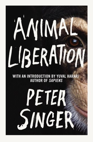 "Book cover with a chimpanzee's face and white text on a black background."