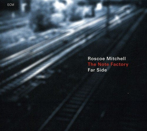 "Album cover featuring a blurred image of train tracks with text overlay."