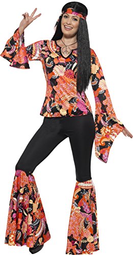 A woman wearing a multicolored hippie costume, including a patterned top, bell-bottom pants, and headband.