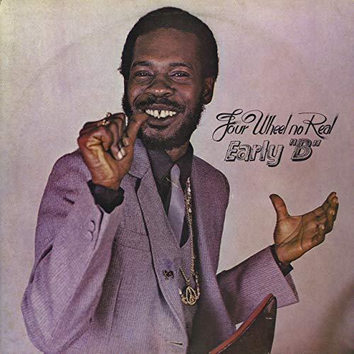 Vinyl album cover featuring a man in a purple suit gesturing.