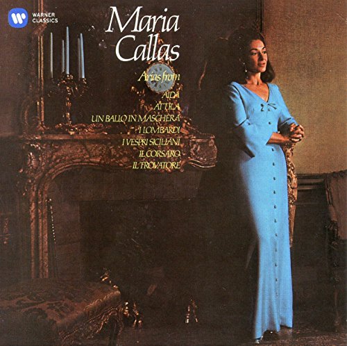 Maria Callas album cover with a woman in a blue dress standing by a fireplace.