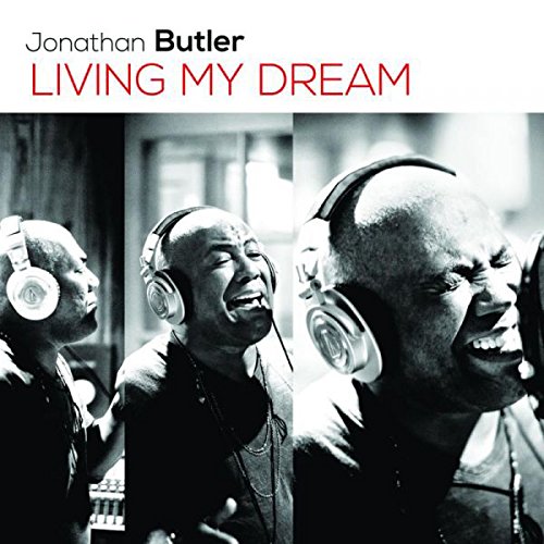 "Album cover featuring a man wearing headphones, singing, in three different poses."