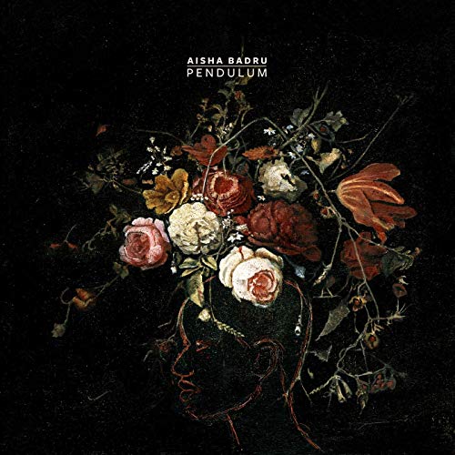 "Album cover art featuring a profile of a head with flowers on it."