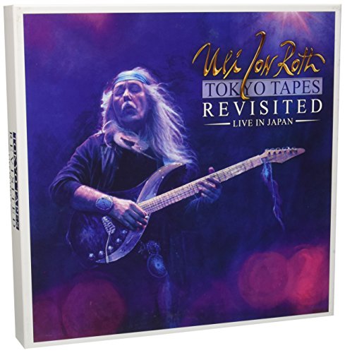Vinyl album cover featuring a man playing guitar on a purple background.