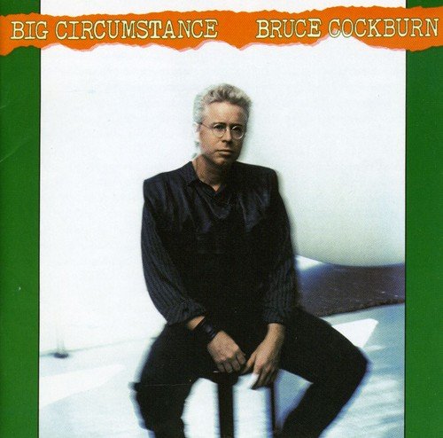 "Album cover with Bruce Cockburn sitting on a stool, wearing black, against a white background."