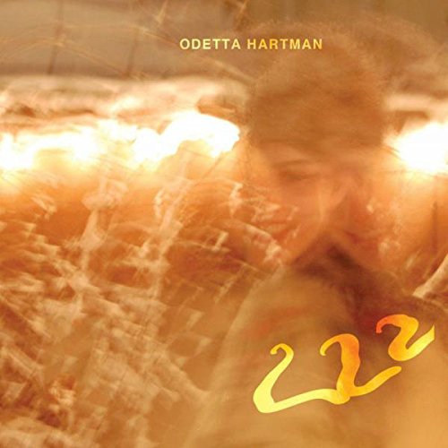 "Odetta Hartman's album cover with blurry portrait and '222' in yellow text."