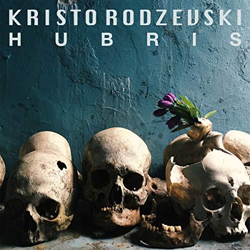 "Album cover with skulls and a purple flower against a blue wall."