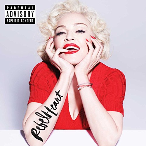Madonna's album cover featuring her in red, with "Rebel Heart" written on her arm.