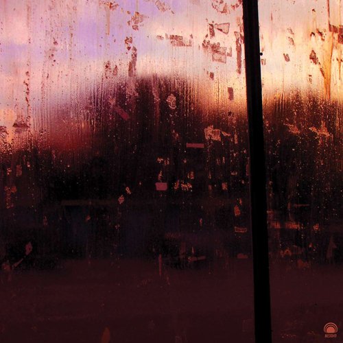 A dark, abstract vinyl album cover with a blurry, distorted image and a black vertical line.