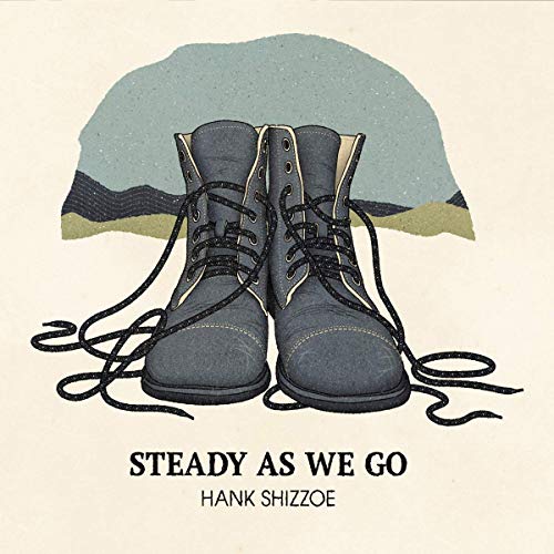 "Album cover featuring a pair of gray boots with untied laces on a beige background."